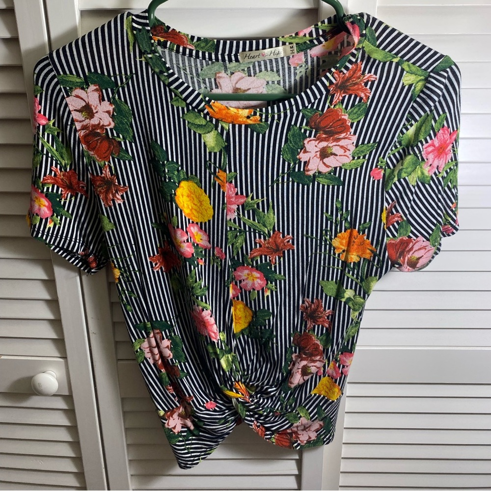 Flower print shirt.